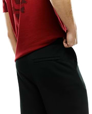 Men's Johan Straight-Leg Sweatpants in black, featuring a relaxed fit, smooth knit fabric, and a zippered back pocket, paired with a red jersey t-shirt with a dark graphic print. (3)