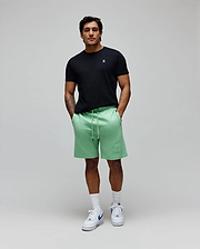 Black jersey t-shirt with small white embroidered Psycho Bunny logo on chest. Mens Barry Short, mint green french terry shorts featuring a large tonal embroidered bunny skull logo on the left thigh.