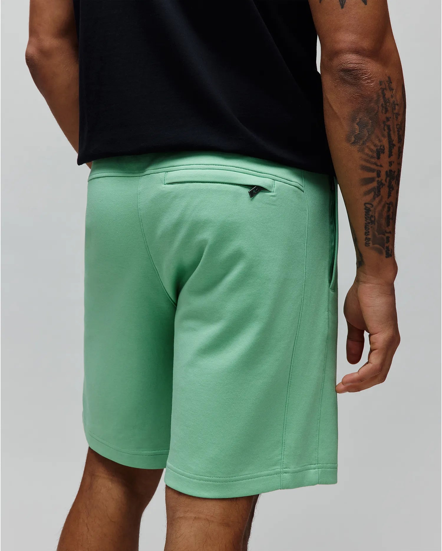 Mens Barry Short in mint green, a relaxed fit premium jersey knit with a rear zippered pocket featuring a small Psycho Bunny logo on the zipper pull.