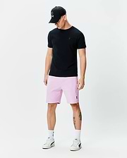 Black jersey t-shirt with tonal Psycho Bunny logo, pale pink Mens Keith Short 8 with embroidered logo, and black trucker cap with white embroidered Psycho Bunny skull.