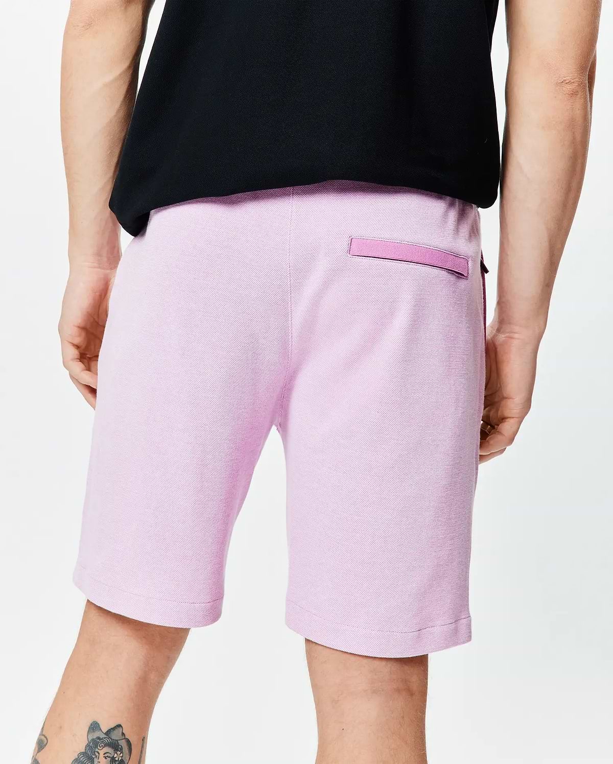 Mens Keith Short 8, heathered pink pique knit shorts with a relaxed fit and a back welt pocket featuring a darker pink trim.