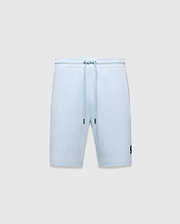 Mens Keith Short 8 light blue pique knit shorts, relaxed fit, featuring a drawstring waist with silver eyelets and dark blue tips, and a small embroidered dark blue Psycho Bunny skull logo on the lower left leg.