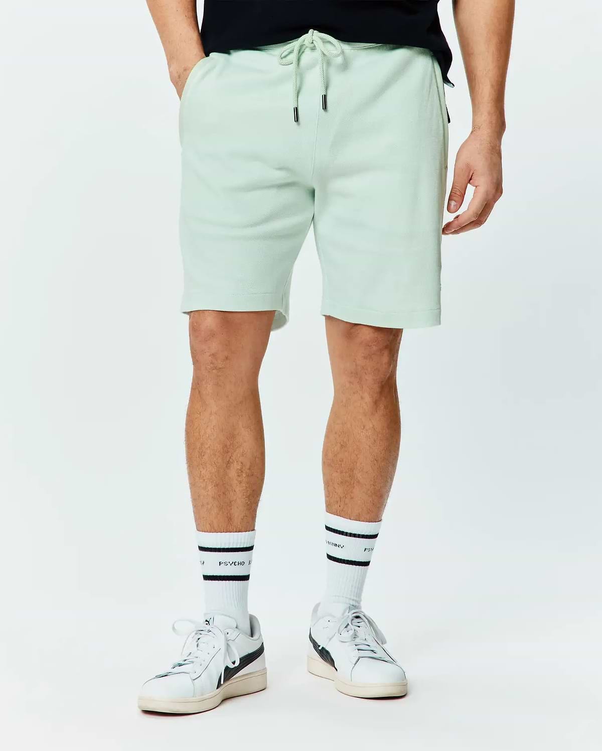 Mens Keith Short 8, a relaxed fit light mint green pique knit short with an adjustable drawstring waist featuring black metal tips and subtle side pockets.