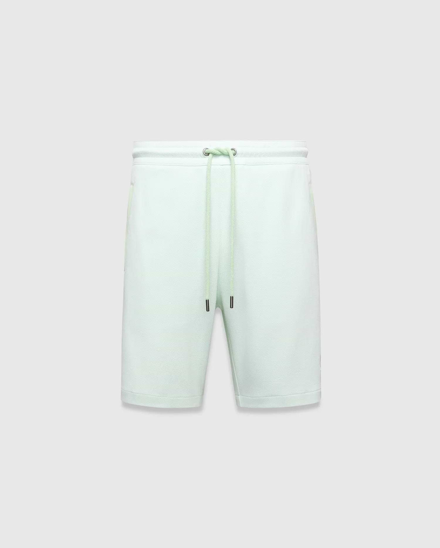 Mens Keith Short 8, light mint green pique knit shorts with a relaxed fit, elastic drawstring waist featuring silver eyelets and black-tipped drawstrings.