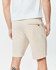 Mens Keith Short 8, light beige textured knit shorts with a classic fit, featuring a rear welt pocket with a dark zipper and side pockets.
