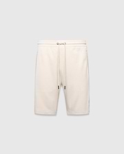 Mens Keith Short 8, cream pique knit shorts with a relaxed fit, featuring a drawstring waist, side pockets, and a small embroidered lavender Psycho Bunny skull logo on the left leg.