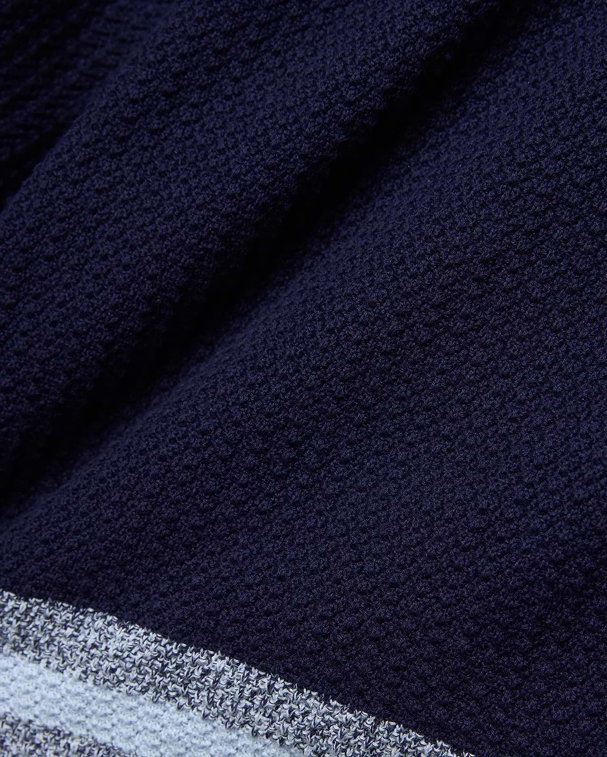 Mens Giles Knit Short 7, crafted from a deep navy textured knit fabric, detailed with a contrasting light blue and white striped hem for a refined streetwear aesthetic.