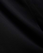 Mens Isaac Print Short in deep black, showcasing a premium, soft jersey knit fabric with a subtle, refined texture and gentle folds, embodying Psycho Bunny's quality.