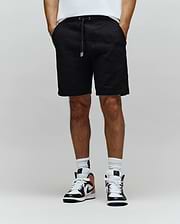 Mens Dustin Sweatshort in black, featuring a relaxed fit and an all-over embossed Psycho Bunny skull pattern, complete with a black drawstring and silver tips.
