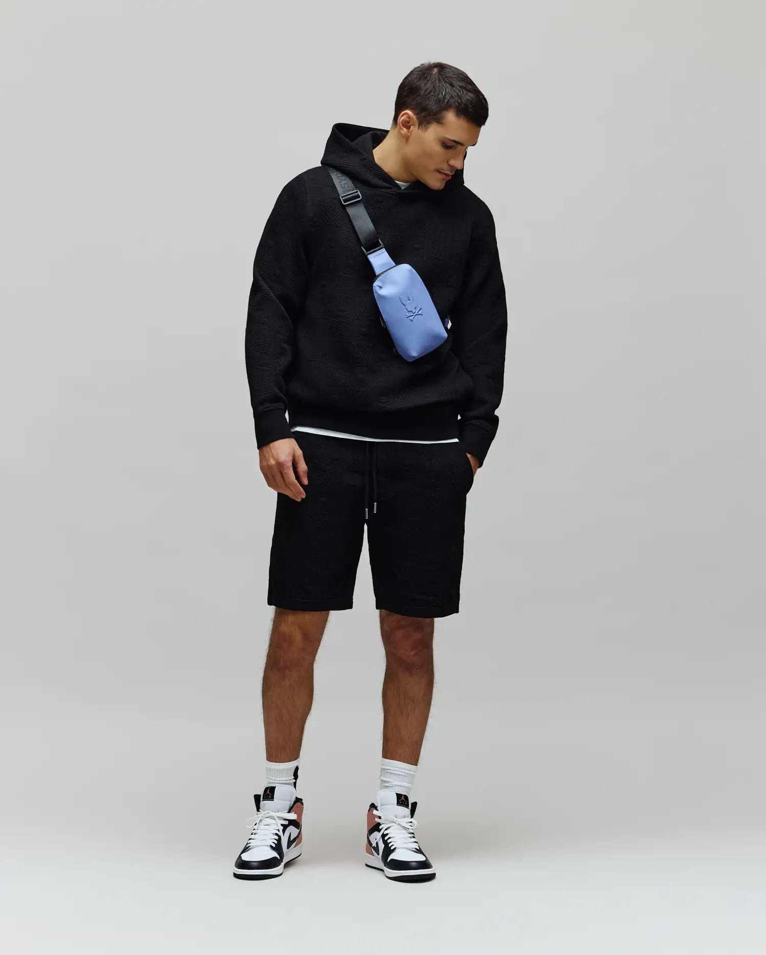 Black relaxed fit textured jacquard hoodie and matching Mens Dustin Sweatshort with drawstring waist, embodying refined streetwear.