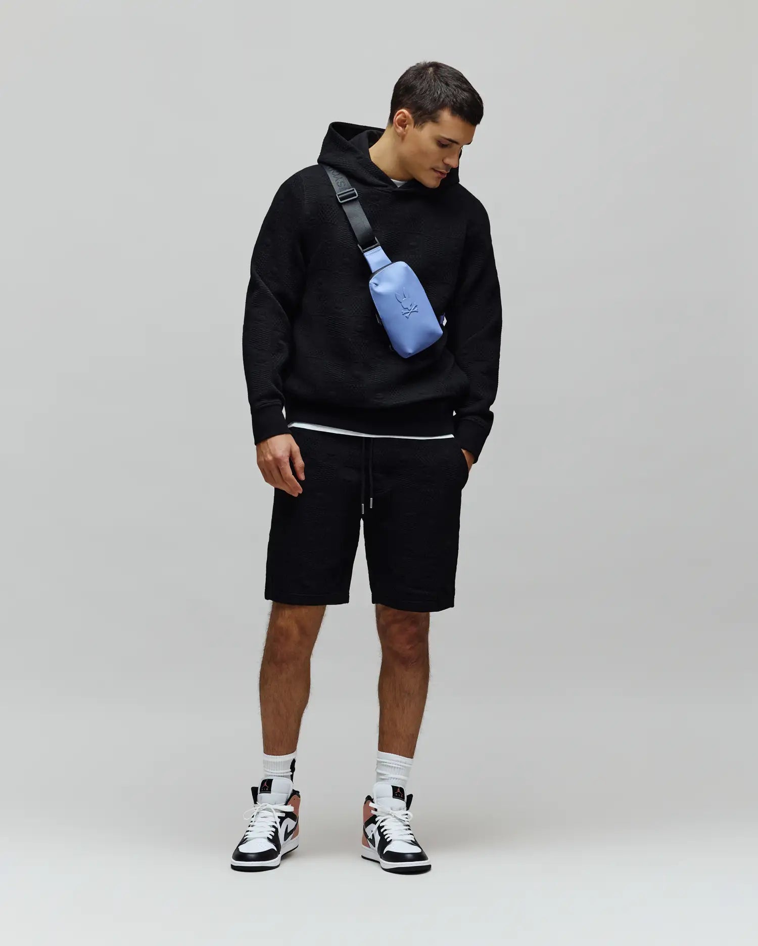 Black relaxed fit textured jacquard hoodie and matching Mens Dustin Sweatshort with drawstring waist, embodying refined streetwear.