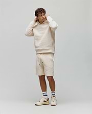 Mens Dustin Sweatshort and matching relaxed fit cream hoodie, both with an allover embossed Psycho Bunny skull logo pattern. Small embroidered bunny logo on hoodie chest, black drawstring tips.