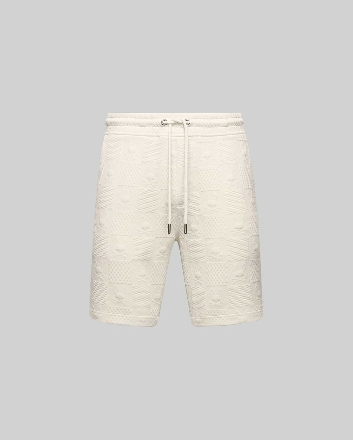 Mens Dustin Sweatshort, cream, featuring a relaxed fit and an all-over embossed checkerboard pattern with alternating Psycho Bunny skull logos and textured squares, complete with a drawstring waist.