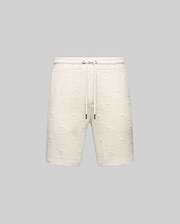 Mens Dustin Sweatshort, cream, featuring a relaxed fit and an all-over embossed checkerboard pattern with alternating Psycho Bunny skull logos and textured squares, complete with a drawstring waist.