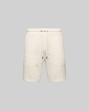 Mens Dustin Sweatshort, cream, featuring a relaxed fit and an all-over embossed checkerboard pattern with alternating Psycho Bunny skull logos and textured squares, complete with a drawstring waist.