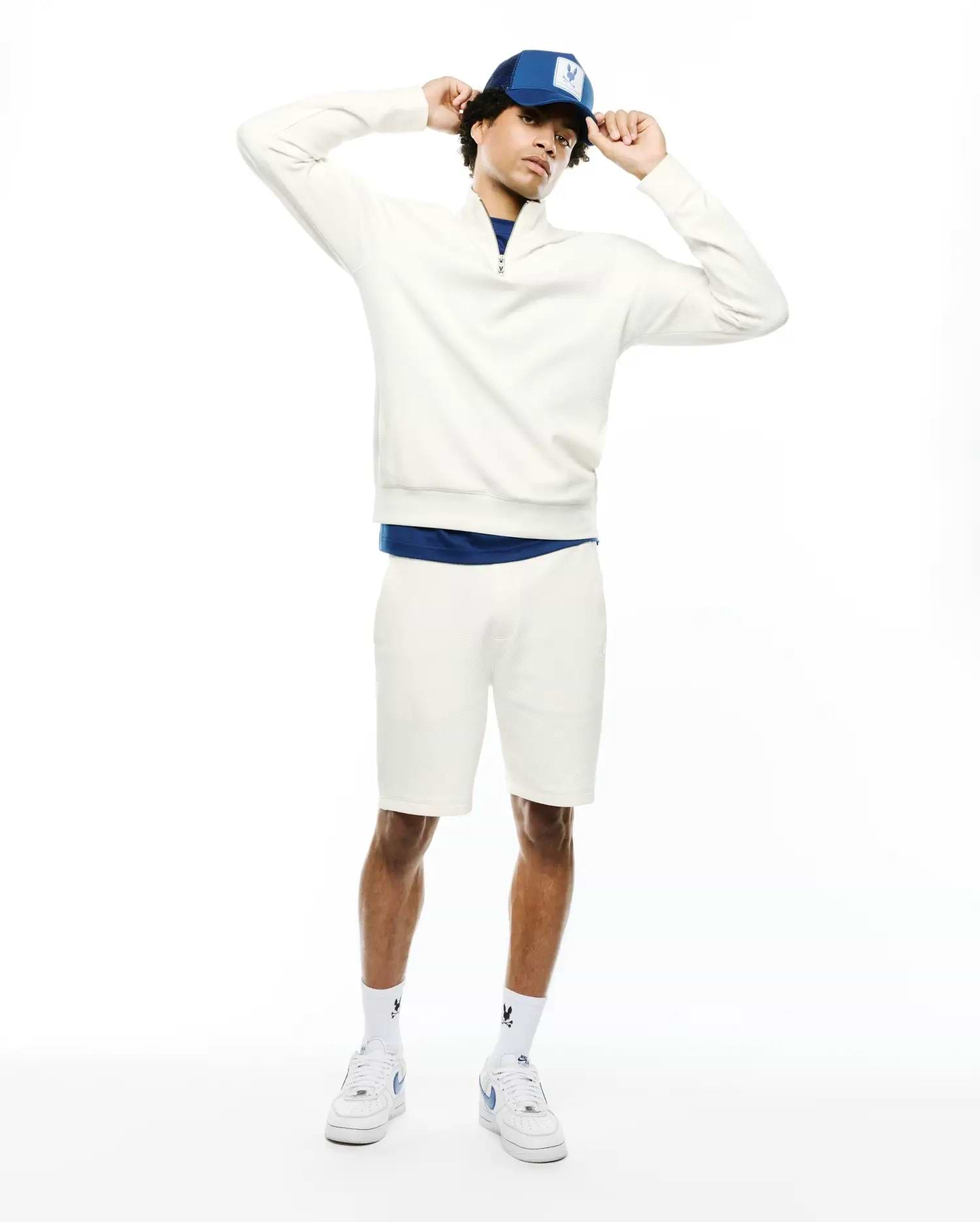 Cream textured quarter-zip sweatshirt with a small embroidered Psycho Bunny skull logo on the left chest, paired with matching MENS MARC TEXTURED SHORT, featuring a classic fit.