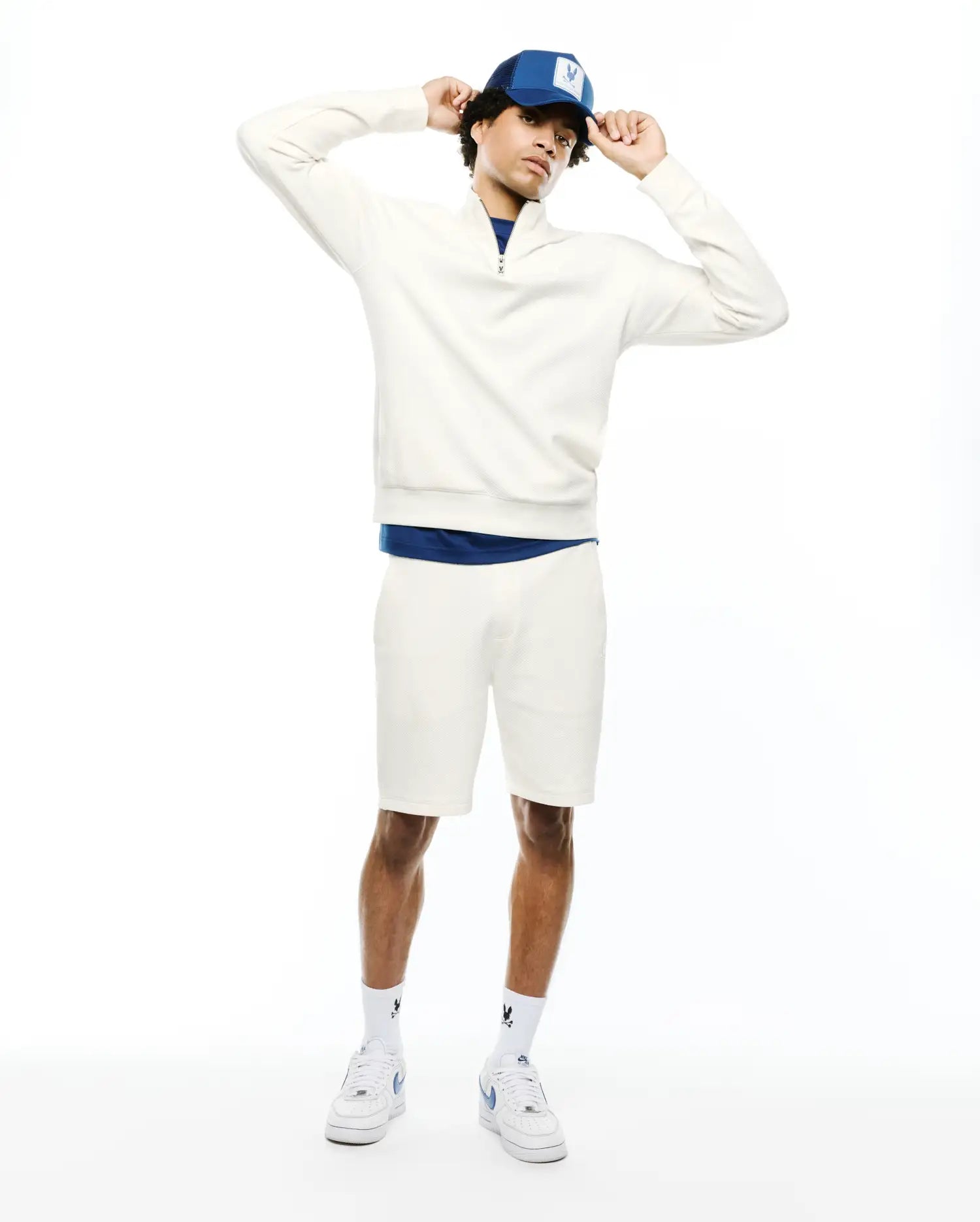 Cream textured quarter-zip sweatshirt with a small embroidered Psycho Bunny skull logo on the left chest, paired with matching MENS MARC TEXTURED SHORT, featuring a classic fit.