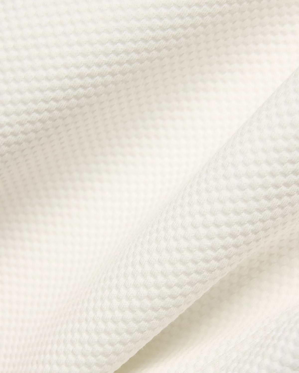 Psycho Bunny Mens Marc Textured Short fabric in cream, showcasing a premium, soft waffle knit texture with a refined, subtle raised pattern.