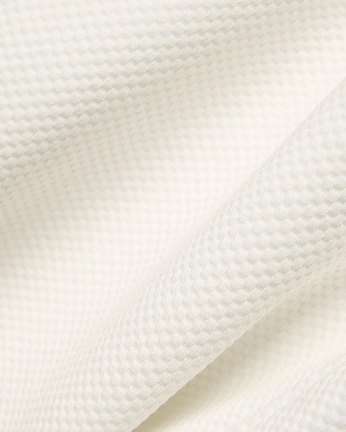 Psycho Bunny Mens Marc Textured Short fabric in cream, showcasing a premium, soft waffle knit texture with a refined, subtle raised pattern.