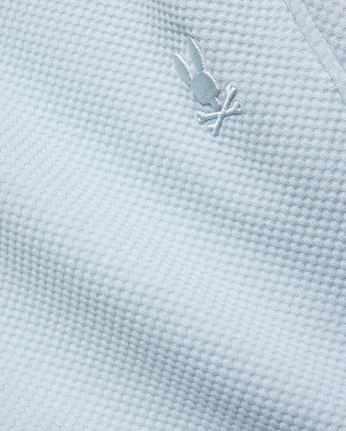 Mens Marc Textured Short in light blue, featuring a premium textured knit fabric and a small, iconic tone-on-tone embroidered Psycho Bunny skull logo.