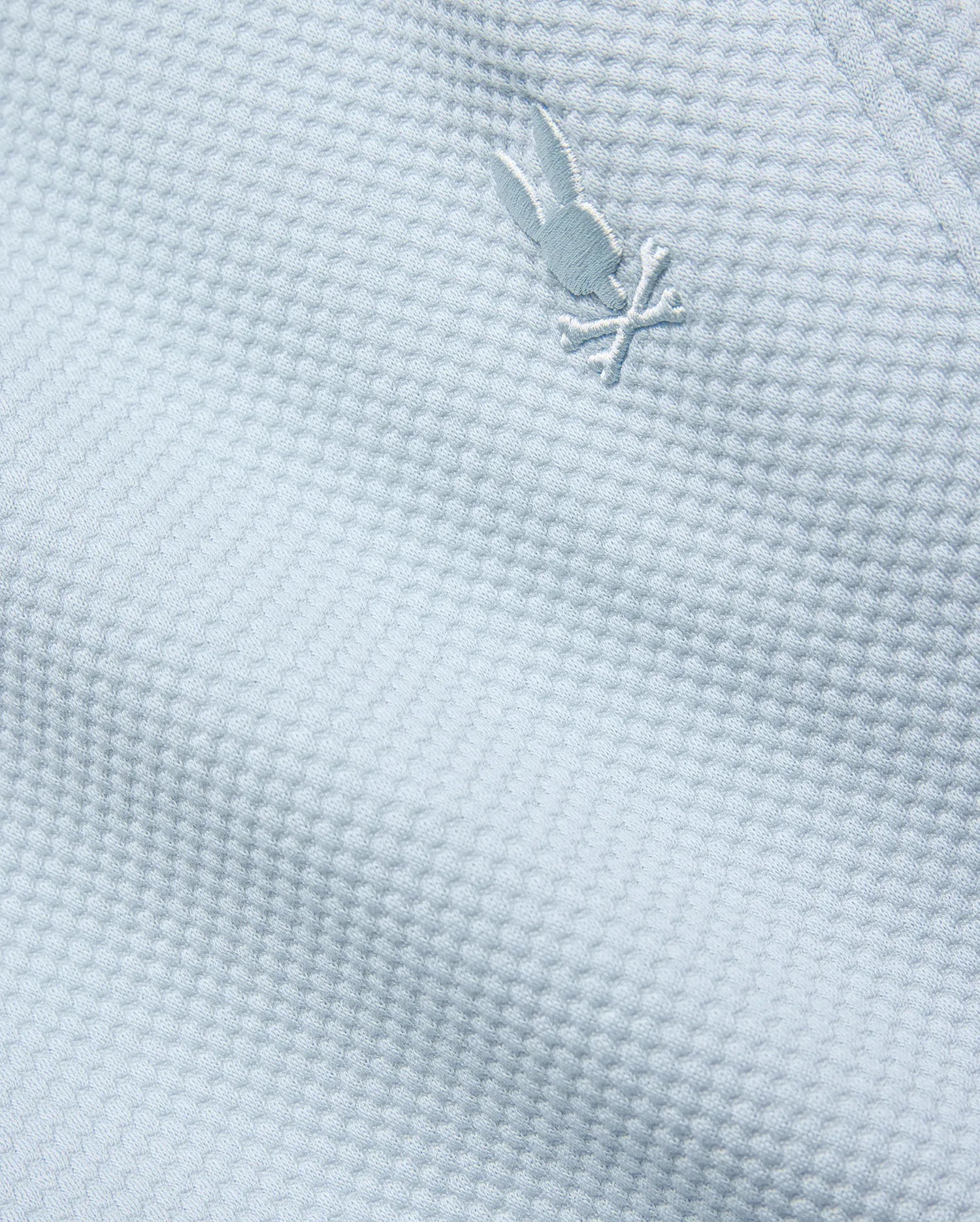 Mens Marc Textured Short in light blue, featuring a premium textured knit fabric and a small, iconic tone-on-tone embroidered Psycho Bunny skull logo.