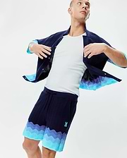 Mens Holden Knit Short 6 in navy, featuring a wavy knit texture, relaxed fit, gradient light blue and purple wave pattern at the hem, and an embroidered Psycho Bunny skull logo on the left thigh. (3)