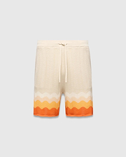 Mens Holden Knit Short in cream with a wavy knit texture, featuring a relaxed fit, drawstring waist, and a vibrant orange and yellow gradient stripe pattern at the hem.