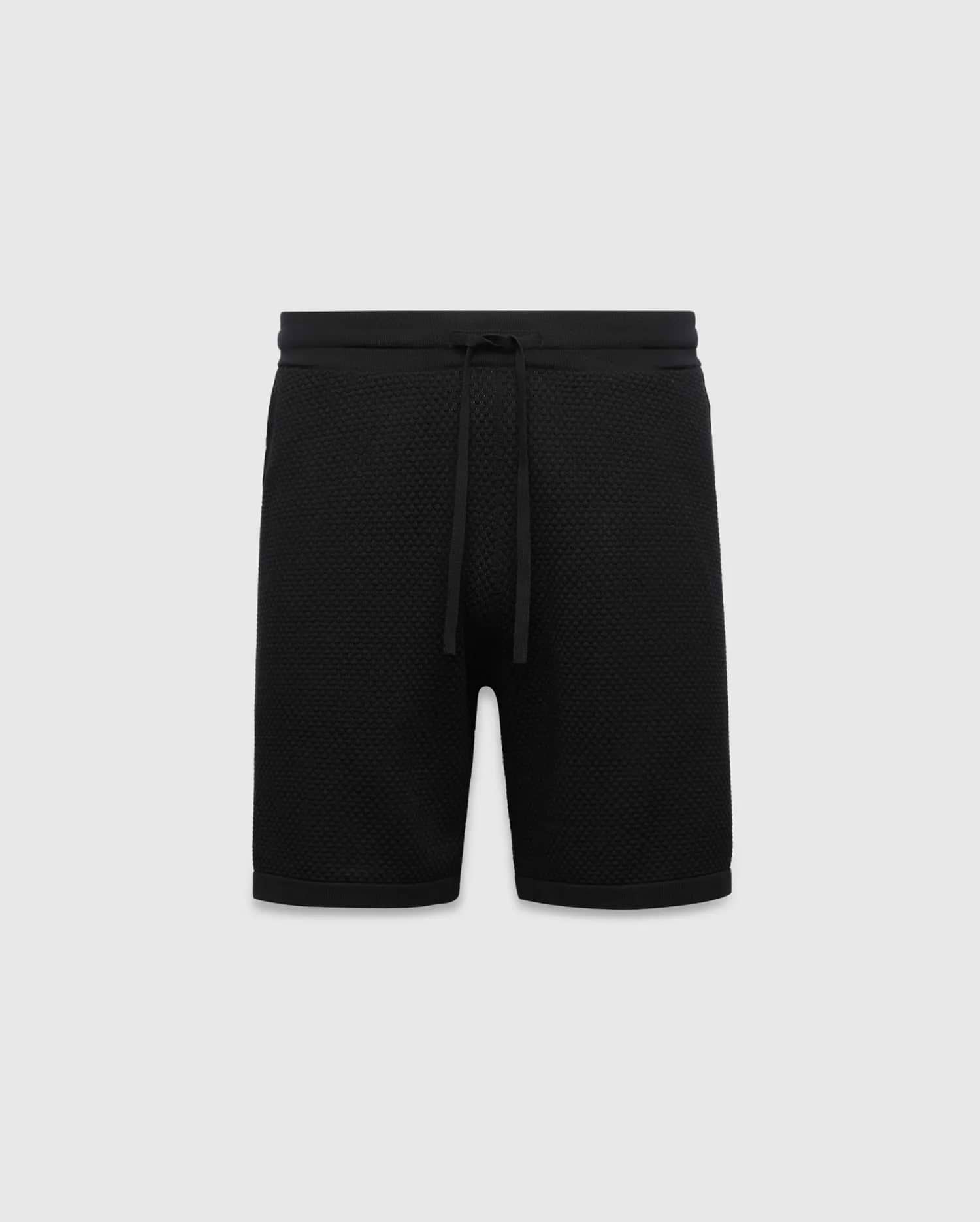Black MENS DEVON KNIT SHORT with a relaxed fit, featuring a textured knit fabric, ribbed waistband, and drawstring closure. No visible Psycho Bunny logo.