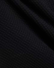 Mens Devon Knit Short in rich black, showcasing a premium, subtly textured knit fabric with a refined mini-waffle pattern, embodying sophisticated streetwear style.