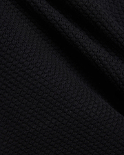 Mens Devon Knit Short in rich black, showcasing a premium, subtly textured knit fabric with a refined mini-waffle pattern, embodying sophisticated streetwear style.