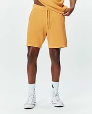 Mens Devon Knit Short, a premium golden yellow textured knit short with a relaxed fit, featuring a comfortable drawstring waist and ribbed hem, embodying refined streetwear style.