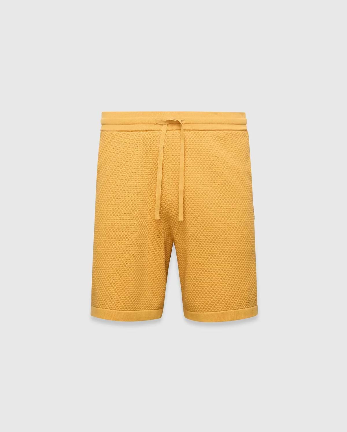 Mustard yellow Mens Devon Knit Short, a relaxed fit, premium textured waffle knit short with an adjustable drawstring waist and ribbed hem.