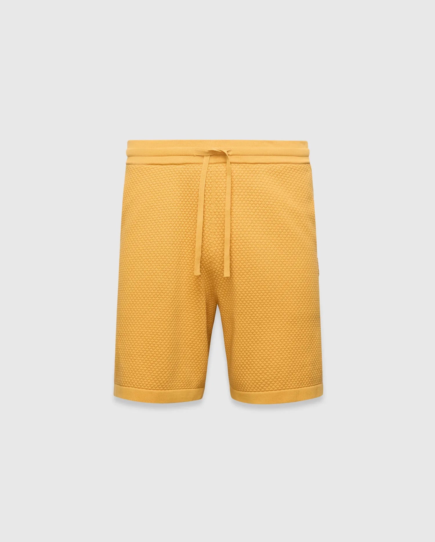 Mustard yellow Mens Devon Knit Short, a relaxed fit, premium textured waffle knit short with an adjustable drawstring waist and ribbed hem.