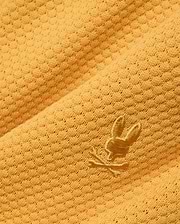 Mustard yellow Mens Devon Knit Short crafted from a textured knit fabric with a subtle geometric pattern, featuring a small, tonal embroidered Psycho Bunny skull logo.