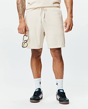 Mens Devon Knit Short, a premium relaxed fit cream textured waffle knit short, featuring a comfortable drawstring waist, soft hand feel, and refined streetwear style.