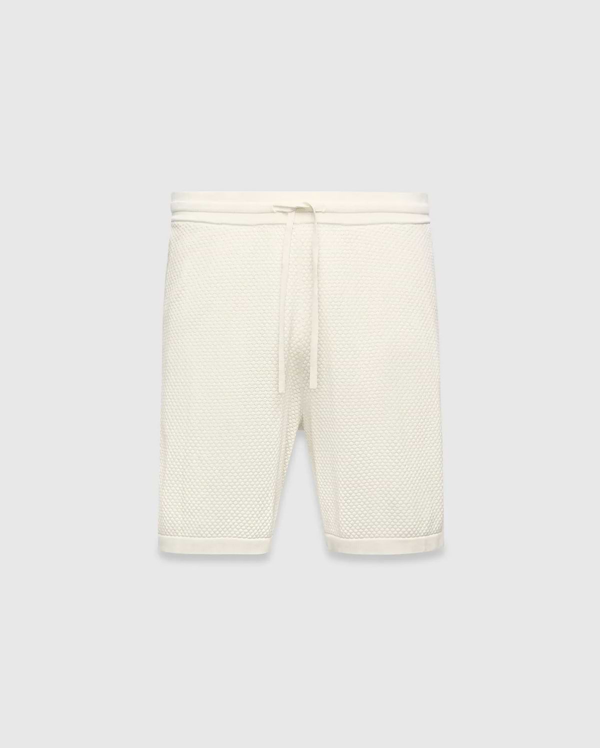 Mens Devon Knit Short in cream, a relaxed fit short crafted from a distinctive textured waffle knit fabric, featuring a ribbed waistband and an adjustable drawstring.
