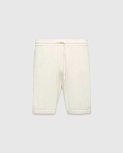 Mens Devon Knit Short in cream, a relaxed fit short crafted from a distinctive textured waffle knit fabric, featuring a ribbed waistband and an adjustable drawstring.