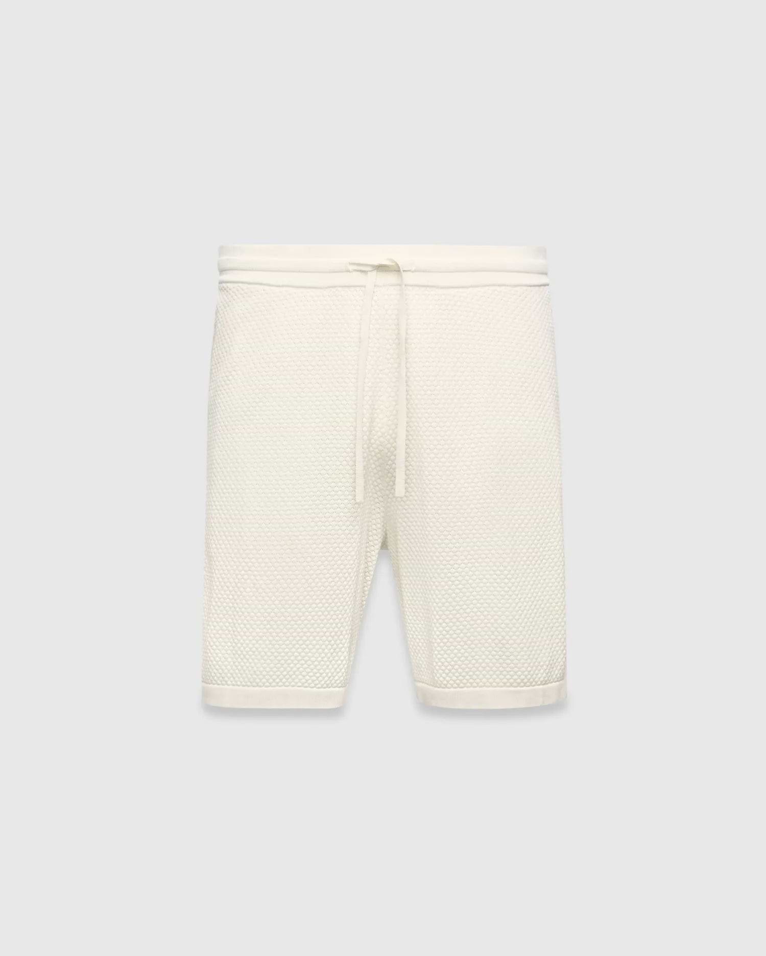 Mens Devon Knit Short in cream, a relaxed fit short crafted from a distinctive textured waffle knit fabric, featuring a ribbed waistband and an adjustable drawstring.