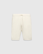 Mens Devon Knit Short in cream, a relaxed fit short crafted from a distinctive textured waffle knit fabric, featuring a ribbed waistband and an adjustable drawstring.