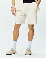 Mens Tristan Short, a premium relaxed fit cream jacquard knit short, showcasing an all-over subtle diamond pattern, comfortable elastic waistband, and practical side pockets for refined streetwear style.