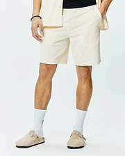 Mens Tristan Short, a premium relaxed fit cream jacquard knit short, showcasing an all-over subtle diamond pattern, comfortable elastic waistband, and practical side pockets for refined streetwear style.