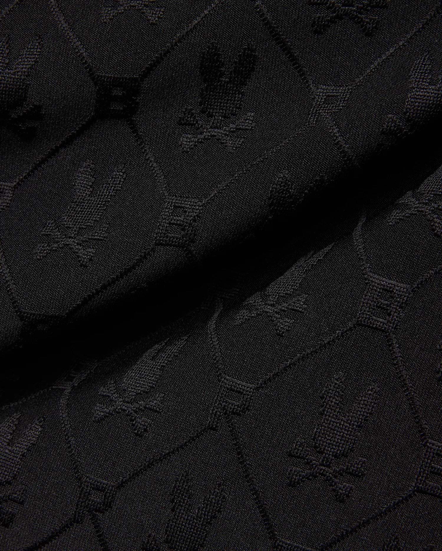 Mens Garry Jacquard Sweatshort in black, featuring a tonal all-over jacquard knit pattern of the iconic Psycho Bunny skull logo and PB initials. (6)