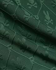 Mens Garry Jacquard Sweatshort in deep forest green, featuring a subtle all-over jacquard knit pattern of the iconic Psycho Bunny skull logo, creating a rich, textured fabric.