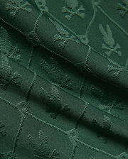 Mens Garry Jacquard Sweatshort in deep forest green, featuring a subtle all-over jacquard knit pattern of the iconic Psycho Bunny skull logo, creating a rich, textured fabric.