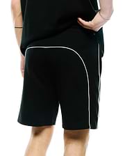 Mens Stevie Short, black relaxed fit jersey shorts featuring prominent white contrast piping that curves across the upper back and extends down the side seams, offering a refined streetwear aesthetic.