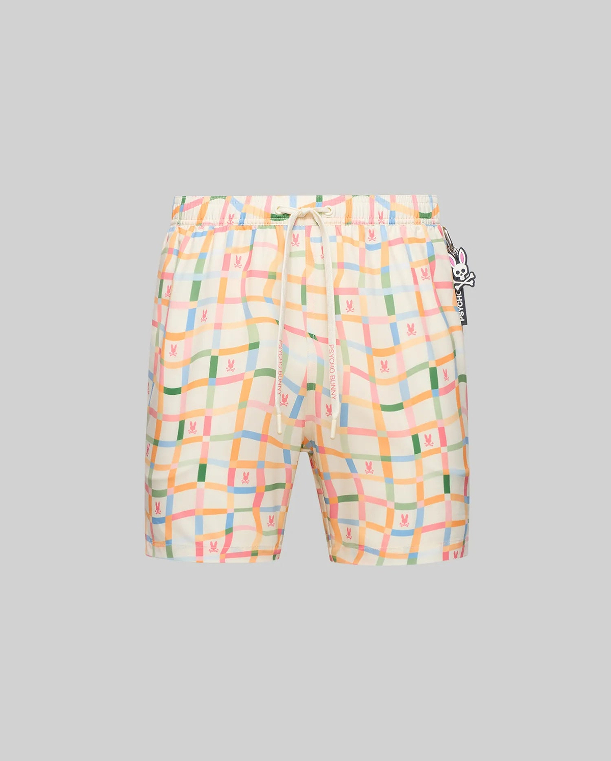 Mens Atlas Swim Trunk, cream with a multicolor wavy plaid pattern, featuring small repeated Psycho Bunny skull logos, a branded drawstring, and a side logo charm.