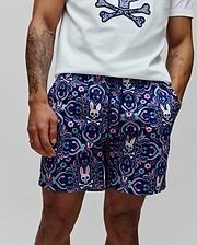 Mens Luke Swim Trunk in navy with an allover intricate floral and paisley pattern featuring repeated pink, light blue, and white Psycho Bunny skull logos, classic fit, smooth quick-dry fabric.