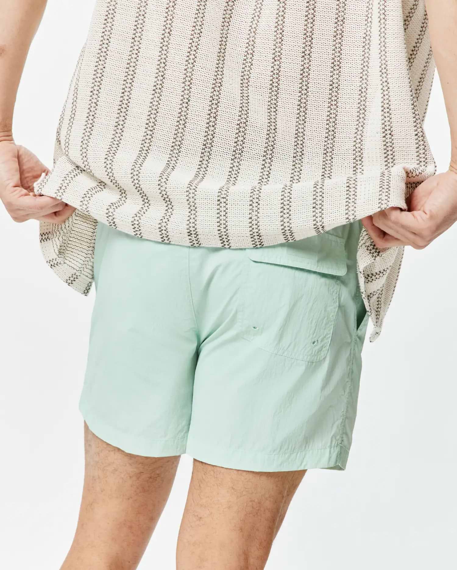 Mens Neo Swim Trunk 4, a light mint green, relaxed fit swim short crafted from crinkled nylon fabric, featuring a back flap pocket and side pockets. (3)