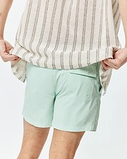 Mens Neo Swim Trunk 4, a light mint green, relaxed fit swim short crafted from crinkled nylon fabric, featuring a back flap pocket and side pockets. (3)