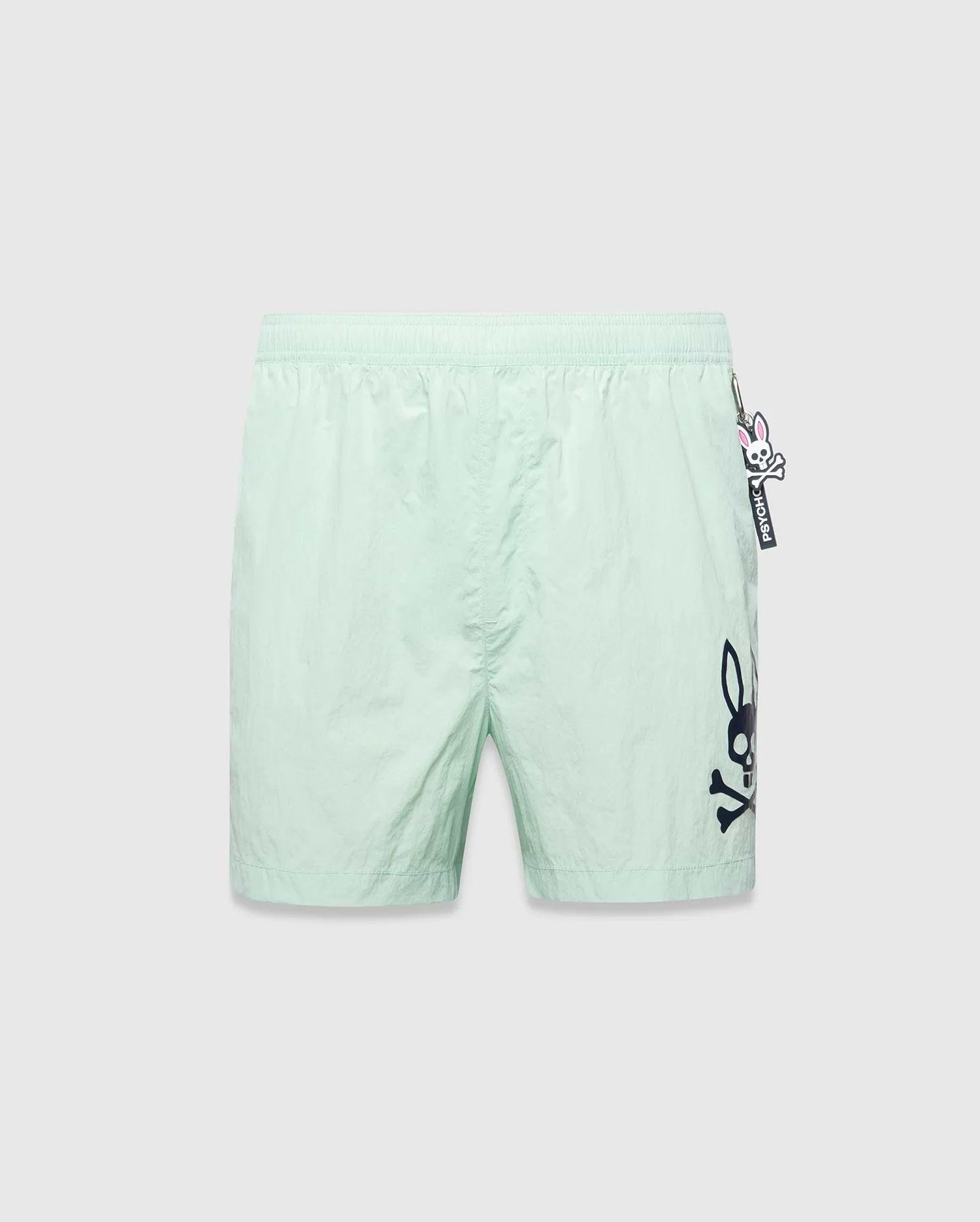 Mens Neo Swim Trunk 4, mint green, relaxed fit, smooth nylon fabric, with a large dark blue Psycho Bunny skull logo print on the right leg and a small Psycho Bunny keychain on the left hip. (5)